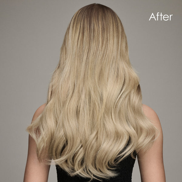 The back of a head showcasing a blonde woman's curly hair extensions, with text reading