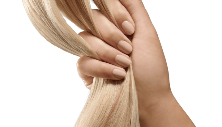 A woman's hand gently holds a strand of long, flowing blonde hair, showcasing its texture and color.