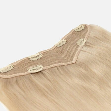 A blonde clip-on hair extension from Vclip, showcasing a sleek and stylish design for enhancing hair volume and length.
